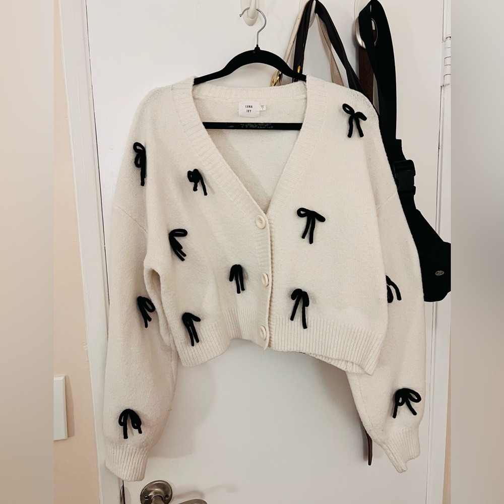 Elegant Cream Cardigan with Black Bow Accents